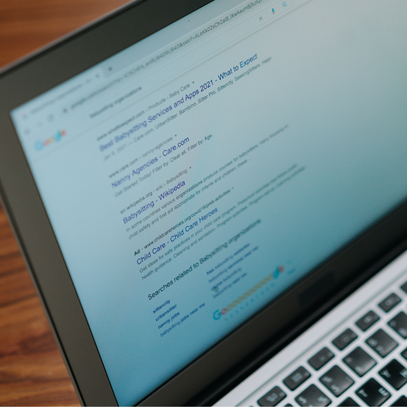 A laptop with a google search page on the screen